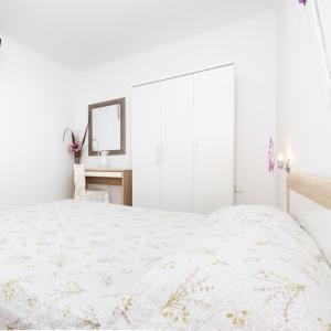 Postel nebo postele na pokoji v ubytování Apartments Dominik