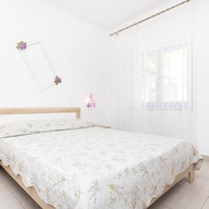 Postel nebo postele na pokoji v ubytování Apartments Dominik