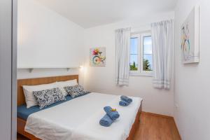 Postel nebo postele na pokoji v ubytování Apartments Tamaris