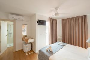 Postel nebo postele na pokoji v ubytování Hotel Internacional