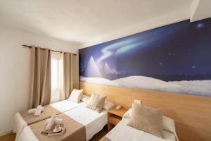 Postel nebo postele na pokoji v ubytování Hotel Internacional