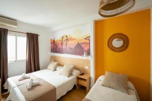 Postel nebo postele na pokoji v ubytování Hotel Internacional