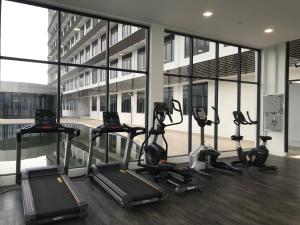a gym with several tread machines in a building at David Studio Unicity, Seremban 3 in Seremban