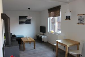 TV a/nebo společenská místnost v ubytování Ferienwohnung Inga