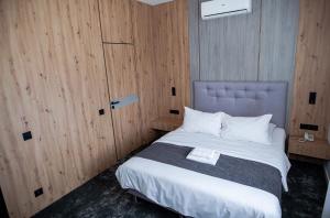 Postel nebo postele na pokoji v ubytování Hotel Tomas