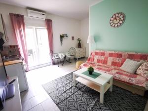 a living room with a couch and a table at Villa Dalma in Tučepi