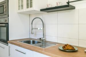 Kuchyň nebo kuchyňský kout v ubytování Apartment Oli