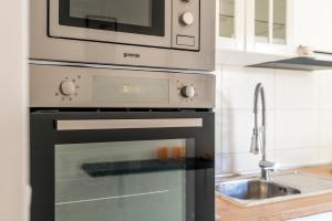 Kuchyň nebo kuchyňský kout v ubytování Apartment Oli