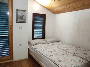 Postel nebo postele na pokoji v ubytování Jovanov Residence - Remote & Accessible