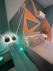 a bedroom with a bed with a painting on the wall at Seaside apartment in Athens