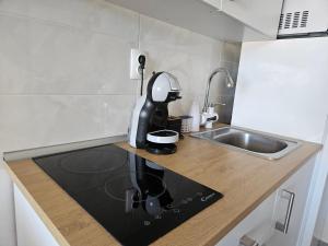 a coffee maker sitting on a counter in a kitchen at Studio apartment PEGY in Vir +39 photos