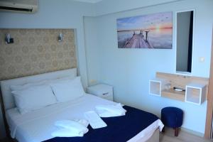 Ein Bett oder Betten in einem Zimmer der Unterkunft Marla Didim Otel