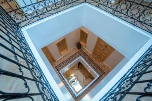 an overhead view of a building with a mirror at Riad Zhor Tanger - Médina in Tangier
