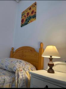 Кровать или кровати в номере Piso Los Jardines