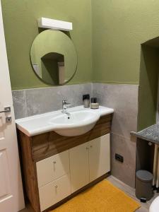 a bathroom with a sink and a mirror at Creton apartment -La casa nel cuore della città- CIR 0121 in Aosta