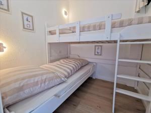 Postel nebo postele na pokoji v ubytování Ferienpark Sierksdorf App 193 - Strandlage Strandkorb