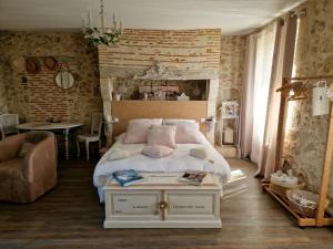 מיטה או מיטות בחדר ב-Au Clair de Vianne