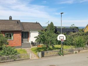a basketball hoop in front of a house at 5 person holiday home in BANKERYD in Bankeryd