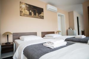 Postel nebo postele na pokoji v ubytování Hotel Tomas