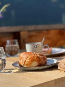 a plate with a loaf of bread on a table at Haus Leopold in Breiten