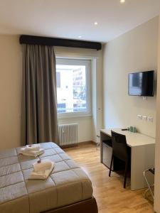 A bed or beds in a room at Rienzo Vatican Suites