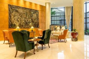 a lobby with chairs and a table and a couch at Park Tower, A Luxury Collection Hotel, Buenos Aires in Buenos Aires