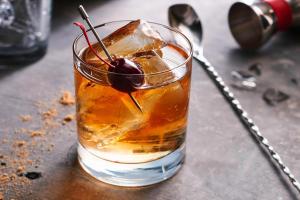 a drink with a cherry on a table at Courtyard by Marriott Riverside UCR/Moreno Valley Area in Riverside