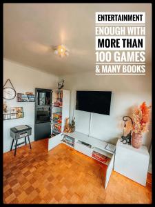 a living room with a flat screen tv on a wall at CASA MARE hartje Oostende met gratis parking in Ostend +28 photos
