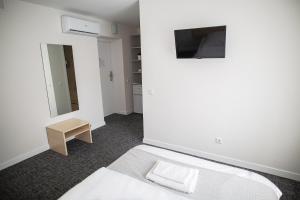TV a/nebo společenská místnost v ubytování Hotel Tomas