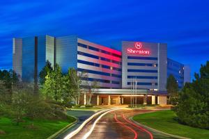 a building with a sign on the side of it at Sheraton Detroit Novi in Novi