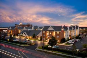 a large building with cars parked in a parking lot at Residence Inn Columbus Easton in Columbus