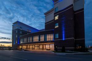 a building with blue lights on the side of it at SpringHill Suites by Marriott Oklahoma City Downtown in Oklahoma City