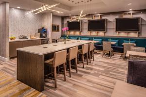 a large conference room with a long table and chairs at Sheraton Dallas Hotel by the Galleria in Dallas