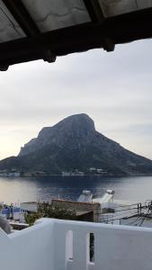 a view of a mountain on a body of water at Blue Sand 2 in Masouri
