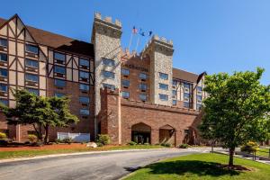a large brick building with two towers at Sheraton Nashua in Nashua