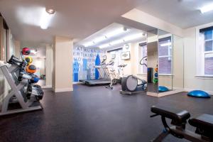 a gym with several exercise equipment in a room at Ellis Hotel, Atlanta, a Tribute Portfolio Hotel in Atlanta