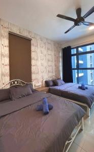 Giường trong phòng chung tại Alantis Residence/CityArea/4-6Pax/Jonker/JHomestay