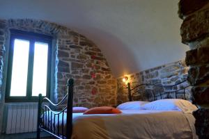 Postel nebo postele na pokoji v ubytování B&B Da Marta