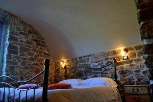 Postel nebo postele na pokoji v ubytování B&B Da Marta