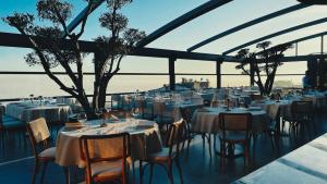 a restaurant with white tables and chairs with a view at Innova Sultanahmet Istanbul in Istanbul