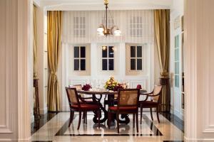 a dining room with a table and chairs at The Hermitage, A Tribute Portfolio Hotel, Jakarta in Jakarta