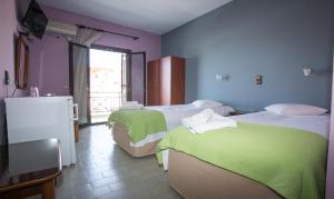 Postel nebo postele na pokoji v ubytování Petania Hotel & Apartments