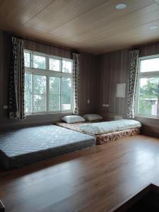 Giường trong phòng chung tại Ming Camphor Homestay