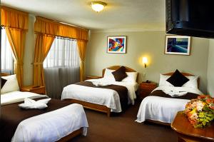 Postel nebo postele na pokoji v ubytování Casona Plaza Balsa Inn