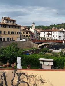 a view of a bridge over a city with buildings at Dalla Rossa in Montelupo Fiorentino