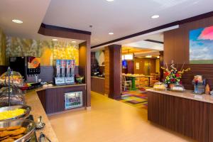 a fast food restaurant with a counter with food at Fairfield Inn and Suites by Marriott Tifton in Tifton