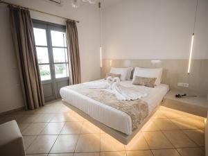 Letto o letti in una camera di Anthemis Suites