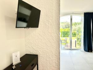 TV a/nebo společenská místnost v ubytování Abitatt