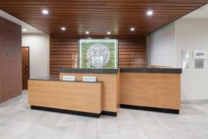 a lobby with a reception desk in a building at Fairfield by Marriott Inn & Suites Anaheim Los Alamitos in Los Alamitos