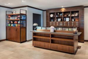 a bar in a room with wooden shelves at Four Points by Sheraton - San Francisco Airport in South San Francisco